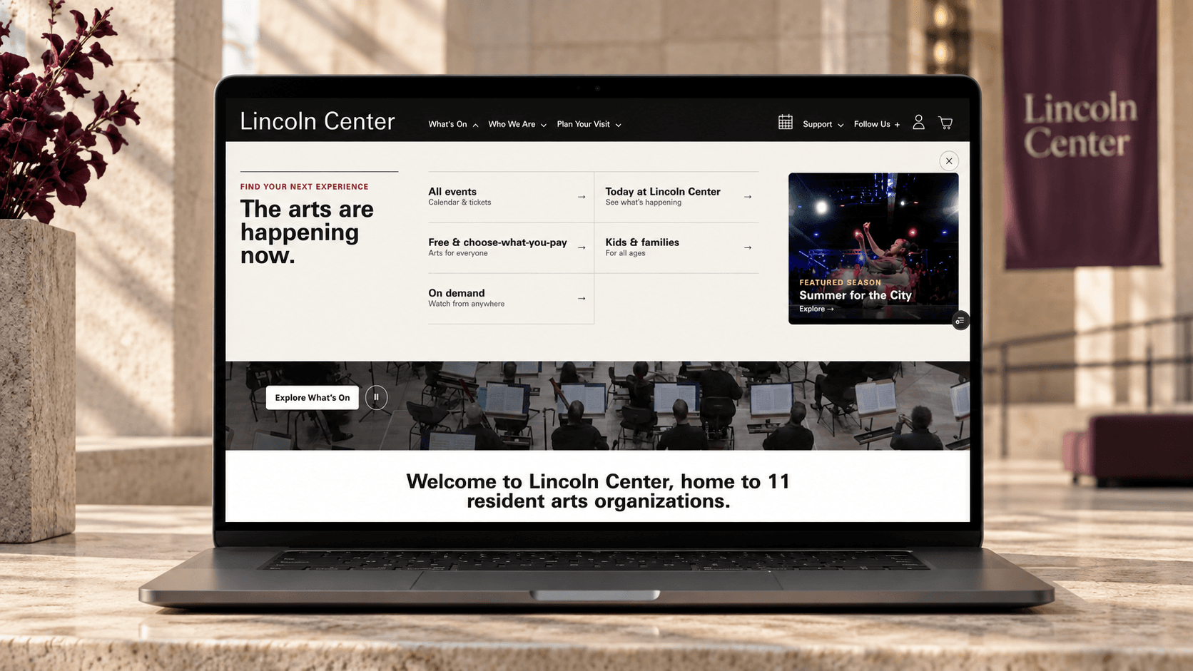 Expanded Lincoln Center discovery menu shown on a front-facing laptop
